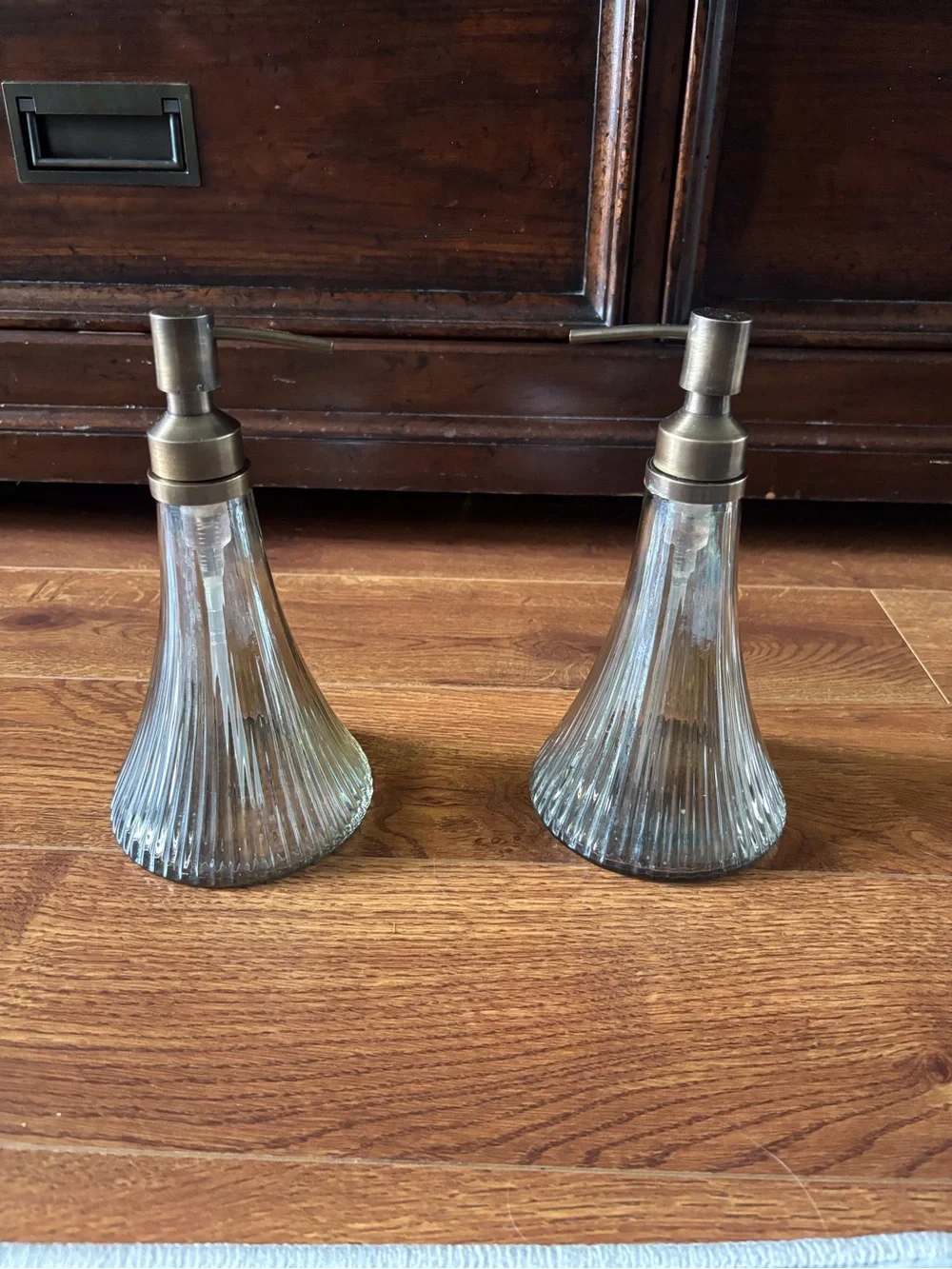Pair of Ribbed Glass Soap Dispensers with Brass-Tone Pumps